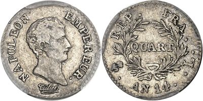 a silver coin with a crown and laurel on it