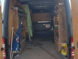 the back of a van with the door open and the back of the van with the door open