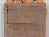 a wooden cabinet with a drawer on top of it