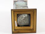 a picture of a picture of a stone in a gold frame