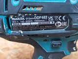 a close up of a cordless drill with a battery in it