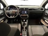 the interior of a car with a steering wheel, dashboard, and dashboard controls