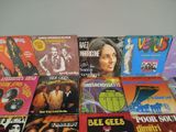 a lot of different vinyl records on the table