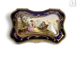 a picture of a blue and gold plate with a painting on it