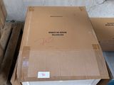 a box that is sitting on a pallet next to some boxes