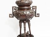 bronze statue of a dog and a cat on a pedestal