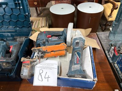 a box of tools sitting on a table in a room