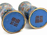 two blue vases with chinese writing on them