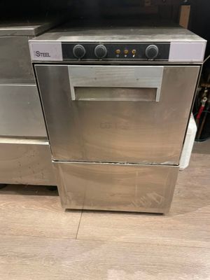stainless steel dishwasher and oven in a kitchen with wooden flooring