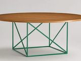 a round table with a wooden top and green metal base