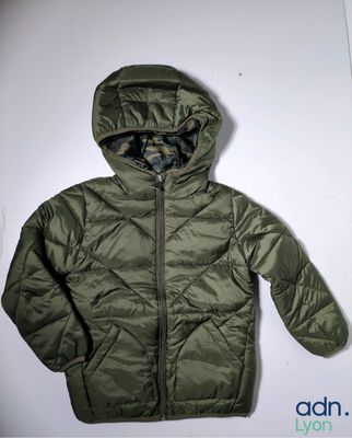 the jacket is green and has a hood on it