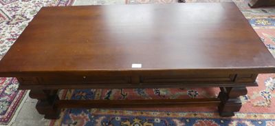 a wooden table with a small drawer on top of it