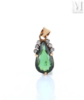 a green tourmaline and diamond pendant on a white background