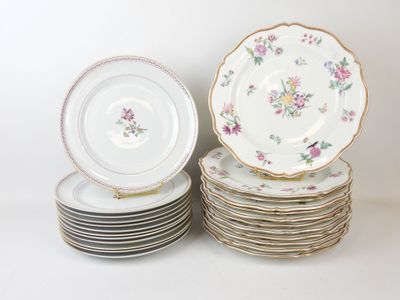 many plates stacked on top of each other on a table