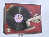 an old record player with a vinyl record on top of it