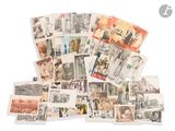 a pile of old postcards on a white surface
