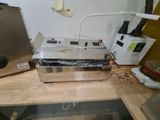 a machine that is sitting on top of a wooden table