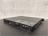 a close up of a black amplifier on a table