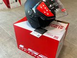 a helmet sitting on top of a box on the floor