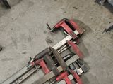 a couple of clamps laying on the floor next to each other