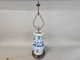 a blue and white lamp that is sitting on a table