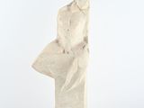 sculpture of a man ' s head made of stone on a white background