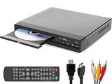 a close up of a dvd player with a remote and cables