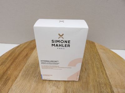 a white box sitting on top of a wooden table