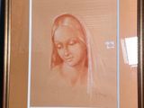 painting of a woman with a veil in a gold frame on a blue wall