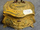 an antique brass box with a price tag on it