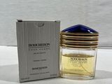 an image of a bottle of perfume sitting next to a box