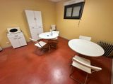 a small kitchen with a table and chairs in it