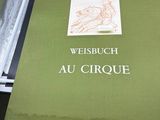 a green book with a picture of a horse on it