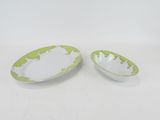 pair of green and white oval serving dishes on a white background