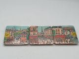 four coasters that have a picture of a city on them