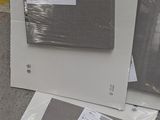 two microwaves and a dishwasher sitting on the floor