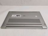 an open laptop computer sitting on top of a white surface