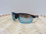 a close up of a pair of sunglasses on a woven basket
