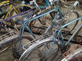 many bicycles that are parked in a garage
