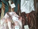 a lot of clothes that are sitting in a box