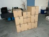 boxes stacked on top of each other in a room with blue walls