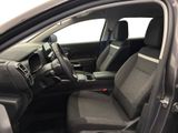 the interior of a car with the door open and the driver ' s seat up