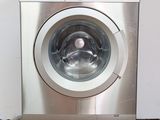 an image of a washing machine on wheels in a room