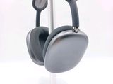 a pair of headphones on a stand on a white surface