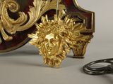 a pair of scissors sitting next to a gold statue