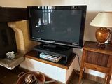 a television that is sitting on a stand in the living room