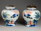 pair of chinese vases with birds and flowers painted on them