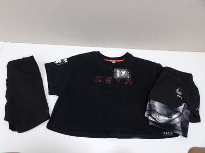 black shirt and pants with a hoodie and a hat on a table