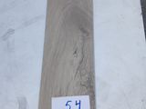 a close up of a piece of wood sitting on top of a table