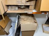 a pile of boxes and boxes on a shelf